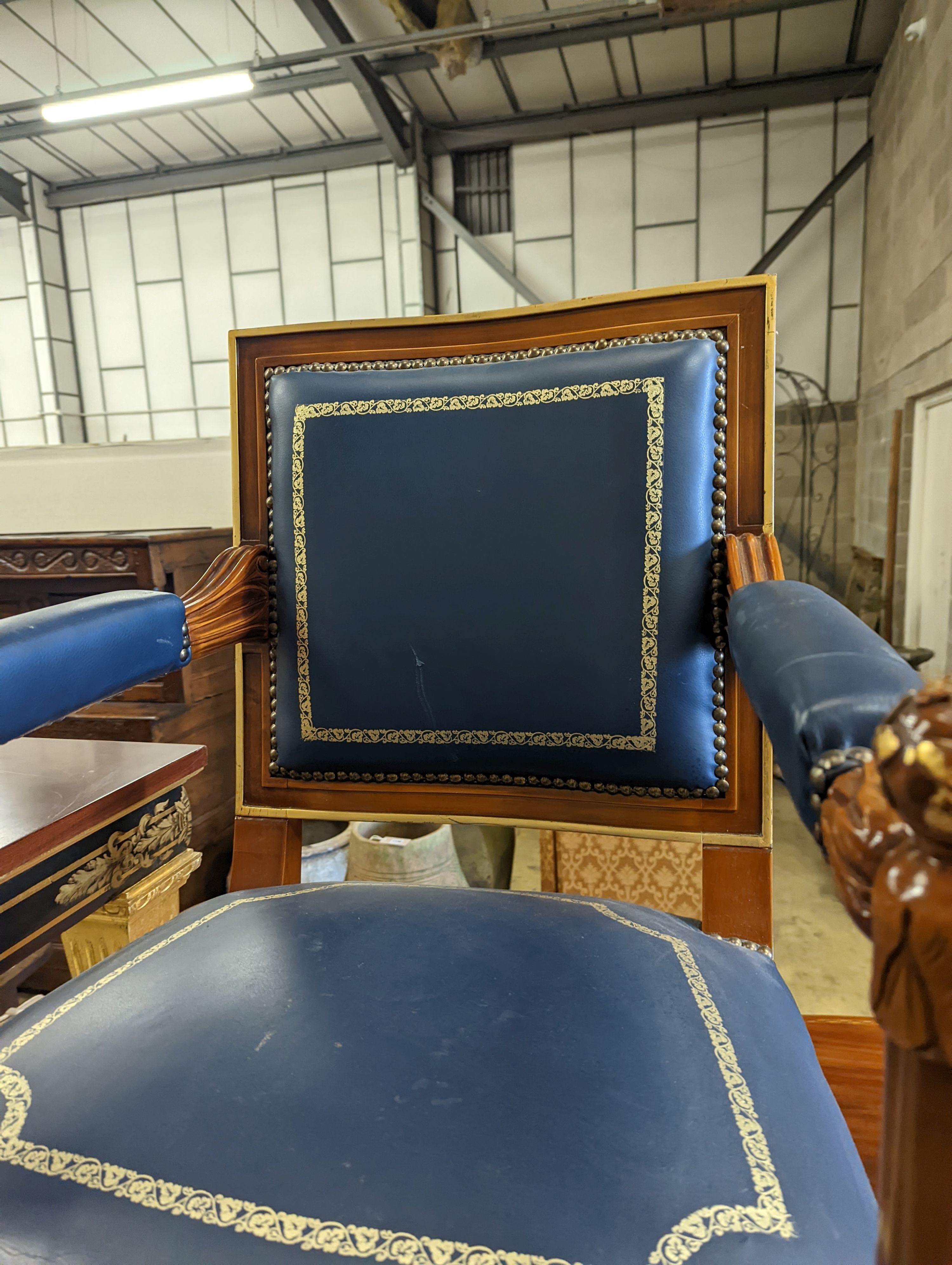 An Empire style parcel gilt mahogany elbow chair together with a similar square low occasional table, width 70cm, height 55cm